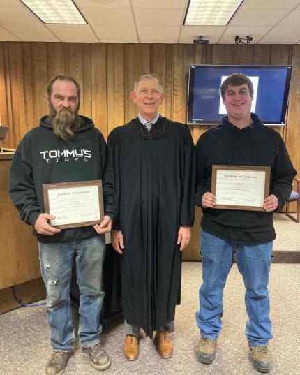 Photo L to R: graduate Daniel, Judge Stecker, and graduate Kasey.